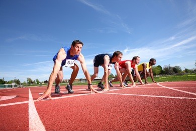 track runners lined up for race