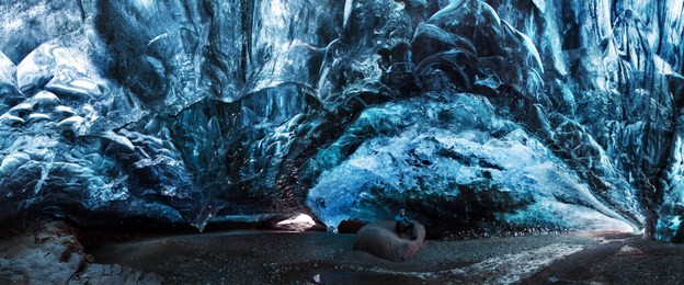 blue crystal ice cave and an underground river beneath the glacier. amazing nature of skaftafell, iceland. vatnajokull national park