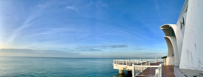 sunrise moments at malacca straits mosque ( masjid selat melaka), it is a mosque located on the man-made malacca island near malacca town, malaysia