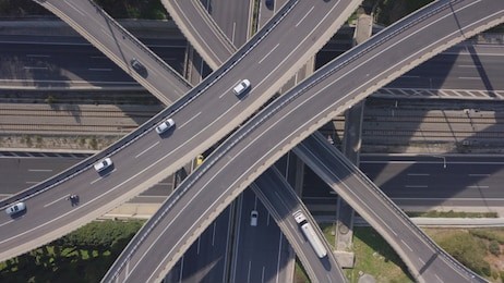 aerial drone top view photo of highway junction multi level overpass passing through city centre