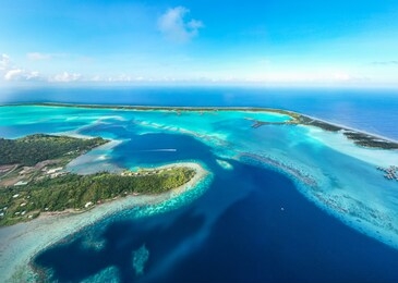 panorama aerial view of bora bora island. luxury hotels and overwater bungalows with blue lagoon, society islands, tahiti french polynesia