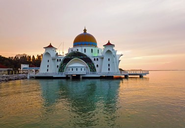 aerial view of majestic malacca straits mosque during sunset