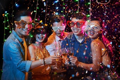 vietnamese young people having fun at birthday party in night club