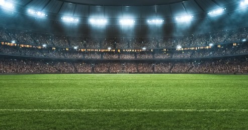 photo of a soccer stadium at night. the stadium was made in 3d without using existing references.