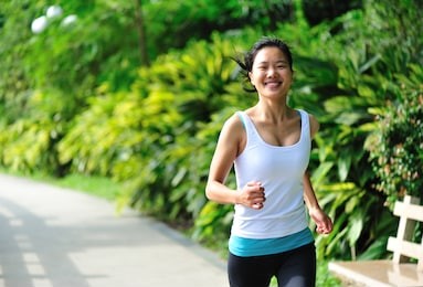 young asian woman jogging  at park