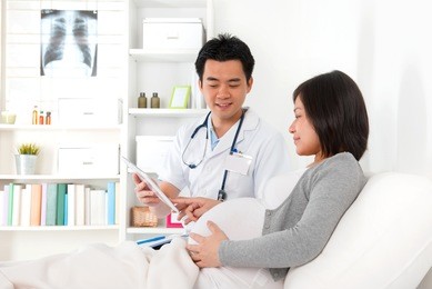 chinese pregnant medical checkup with doctor