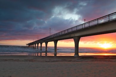 sunrise at new brighton pier, christchurch new zealand