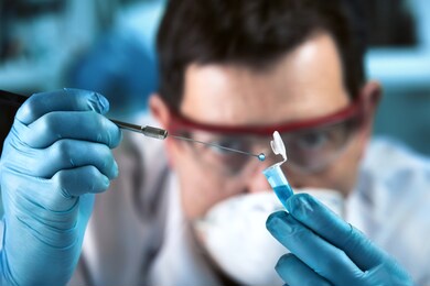 doctor geneticist working with biological samples in genetical lab / technician researcher sampling pcr tube for genetic analytical in the clinical laboratory