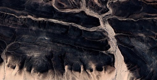 abstract photographs of landscapes of the deserts of africa from the air.