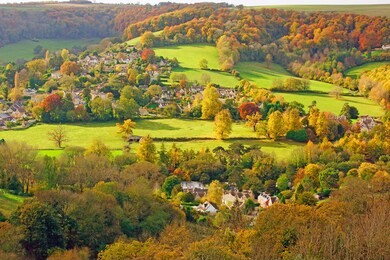the nailsworth valley and an aerial view over a misty woodchester village in autumn, the cotswolds, gloucestershire, uk