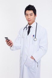 young asian doctor using smar phone isolated on white background.