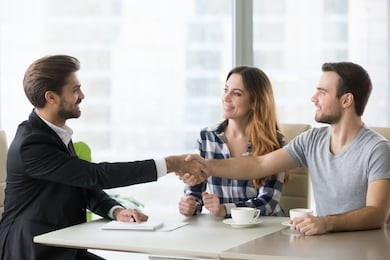 happy clients couple handshake lawyer realtor financial adviser thanking for help, insurer salesman bank worker and millennial customers shake hands make mortgage loan deal, buy insurance services