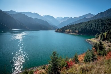 heaven lake (tianchi) of tianshan alpines in xinjiang, china, in the color of autumn season.