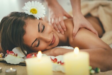 beautiful woman enjoying during a shoulder massage at a spa. 