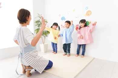 children and teacher at kindergarten