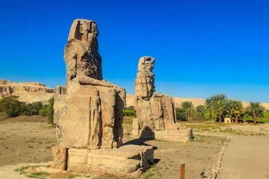 colossi of memnon, two massive stone statues of pharaoh amenhotep iii in luxor, egypt