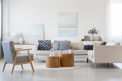 wooden coffee tables in the middle of fashionable living room interior with corner sofa