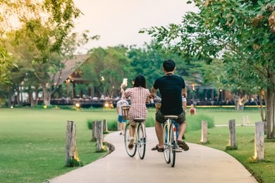 people exercising by cycling in the evening at the public park.