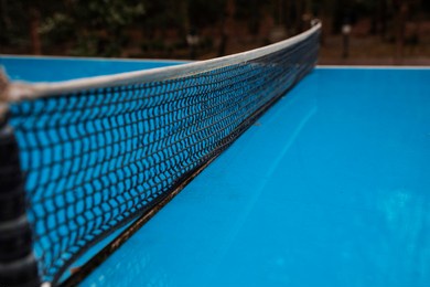 wet table tennis court on street