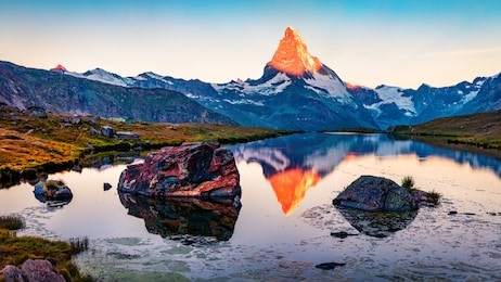 spectacular summer sunrise on stellisee lake. first sunlight glowing peak of matterhorn summit in swiss alps, switzerland, europe. beauty of nature concept background.