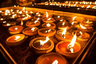 beautiful candle lighting ceremony at wat phan tao. (loy krathong & yee peng lantern festivals)