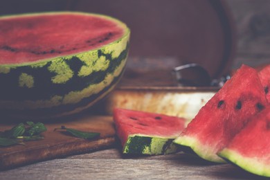 ripe juicy red watermelon on the rustic table.