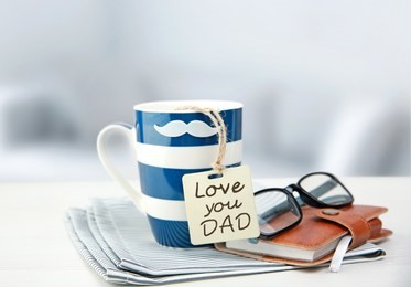 father's day holiday concept ojects. coffee cup mug with message tag.
