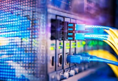 fiber optical cables connected to optic ports and utp network cables connected to ethernet ports.