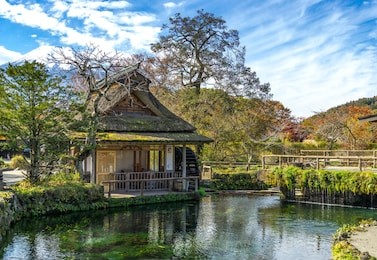 oshino hakkai village with ponds  (a small village in the fuji five lake region) .blue sky,background  mount fuji  , japan - image