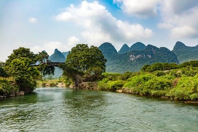  dragon bridge over yulong river at yangshuo, guangxi, china