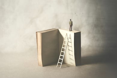 wise man on the top of the book, surreal concept