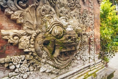 carved statue of balinese demon in ubud palace on bali, indonesia