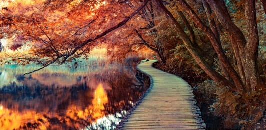 infrared filtered view of plitvice lakes national park. splendid summer scene with footbridge on the pure water lake. picturesque countryside view of croatia, europe. 