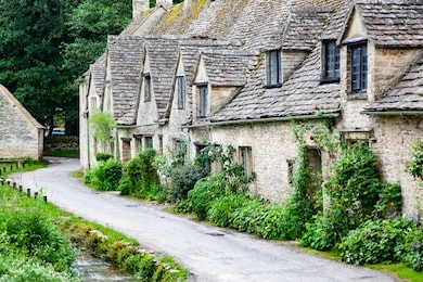 traditional cotswold cottages in england, uk. bibury is a village and civil parish in gloucestershire, england
