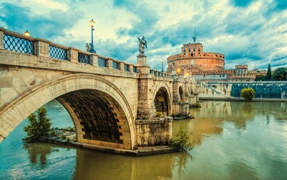bridge and castle sant angelo in rome. sant angelo bridge at twilight.