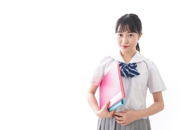 student in uniform with file