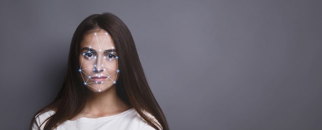 biometric verification. facial recognition of young woman via polygon mask on face, panorama with copy space