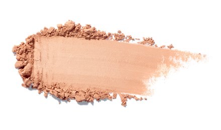 close up of face powder on white background