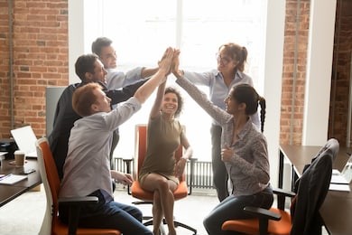 motivated happy diverse business office people employees group give high five with coach mentor engaged in team win result promise support integrity in teamwork, celebrate cooperation reward concept