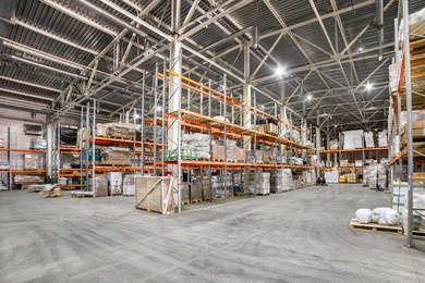 storehouse of logistics companies. long shelves with a variety of boxes and containers.