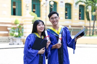 happy graduate asian couple