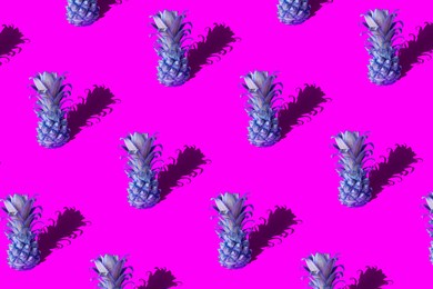 neon pineapple fruits pattern on pink and blue background. summer concept