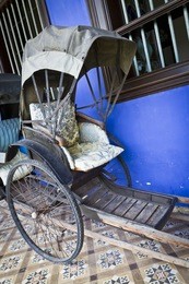cheong fatt tze's blue mansion in georgetown, penang, malaysia. photo of an old tuk-tuk.