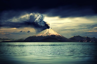 erupting volcano near water - illustration