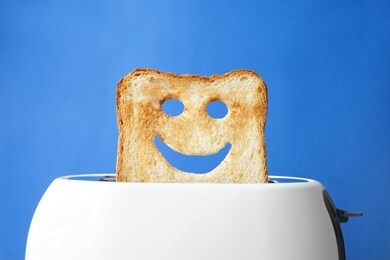 funny slice of bread with toaster on color background