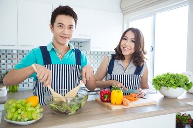 young happy couples in domestic kitchen