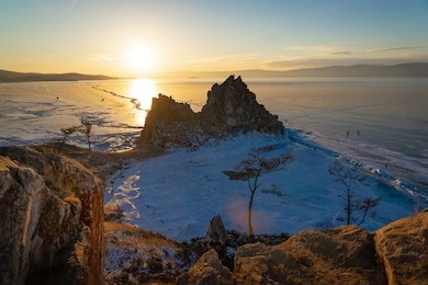 landscape view of the shaman rock, burkhan cape with sunset sky, olkhon island, baikal lake, russia