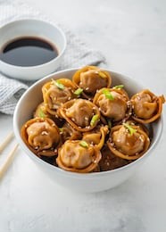 fried dumplings with soy sauce with pepper and green onions. asian cuisine. copy space.