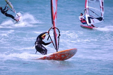 windsurfing on a beach of mediterranean sea