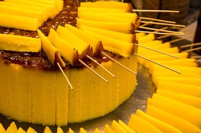 guihuagao yellow glutinous rice cake in a street market xian, shaanxi province, china